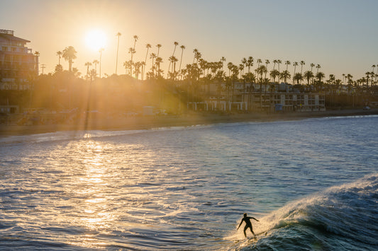 Surfer Catching First Waves of the Day
